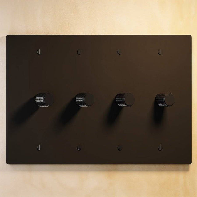 Four-gang The Brass Dimmer Switch - Open Box in matte black, offering bold and functional lighting control.