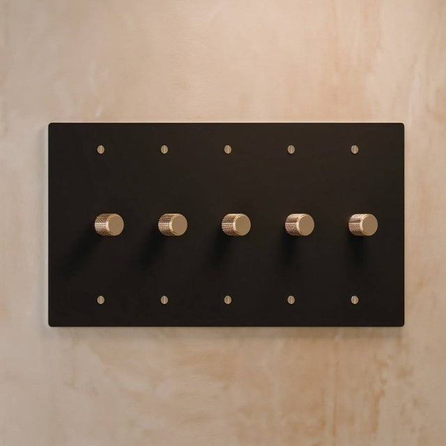 Five-gang The Brass Dimmer Switch - Open Box in matte black with brass knobs, designed for stylish lighting systems.