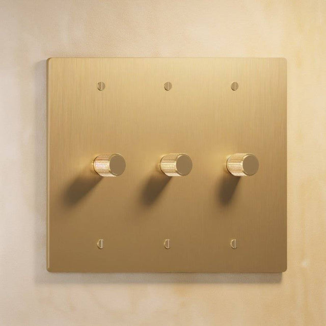 Three-gang The Brass Dimmer Switch - Open Box in polished brass, offering stylish and functional lighting control.