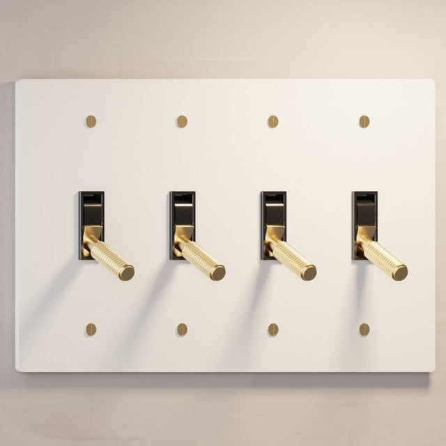 Four-gang The Brass Toggle Switch (1 to 5 Gang) - Open Box in white with gold toggles, ideal for modern and minimalist lighting setups.