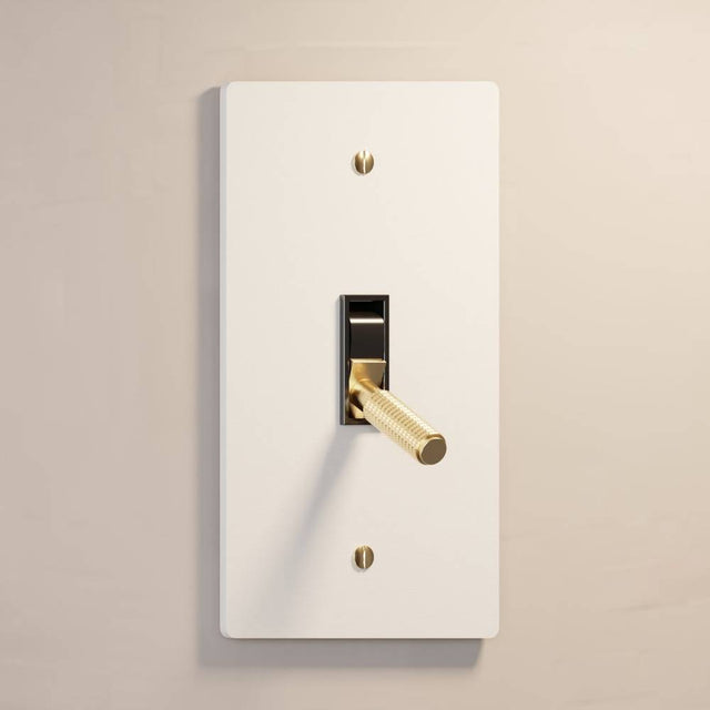 Single gang The Brass Toggle Switch (1 to 5 Gang) - Open Box in matte white with brass toggle, ideal for clean, minimalist interiors.