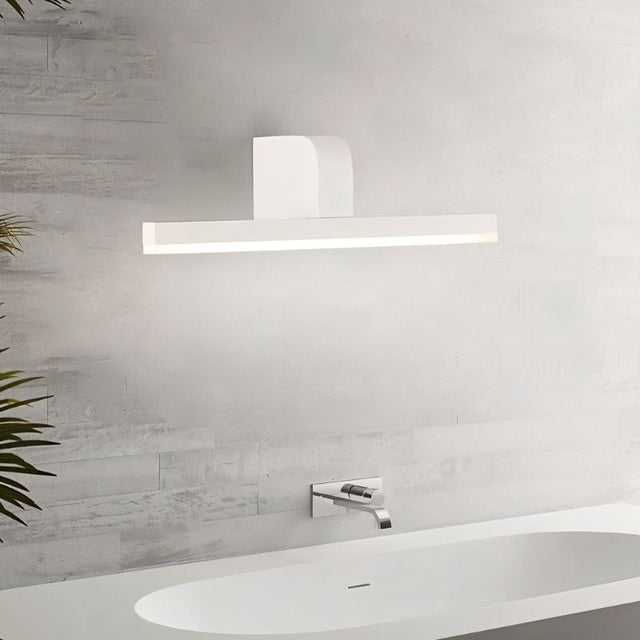 "A modern, white LED vanity light mounted above a bathroom sink and faucet."