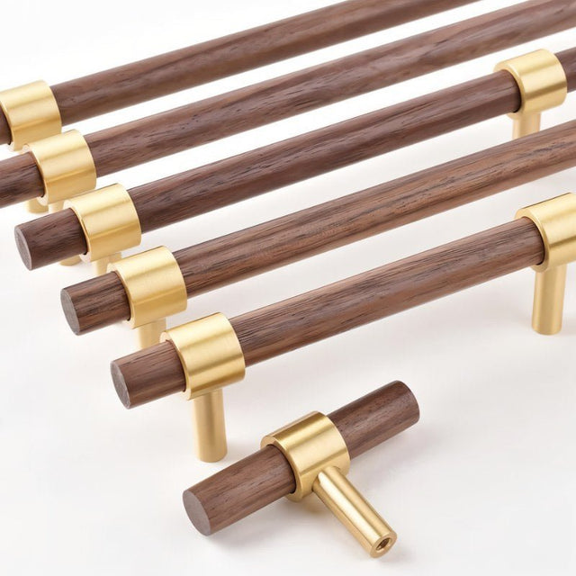 "dark wood pull bars with polished brass fittings, showcasing a sleek and refined design."