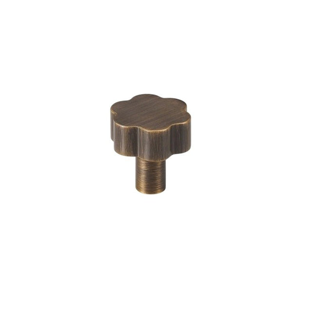 "Bronze brass floral knob with brushed finish, isolated on a white background."