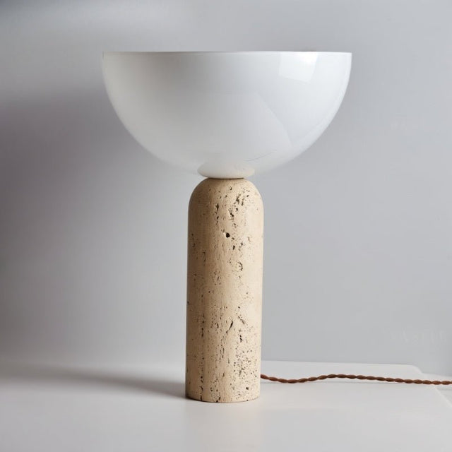 "Minimalist table lamp with a natural travertine cylindrical base and a glossy white glass dome shade, perfect for modern interiors"