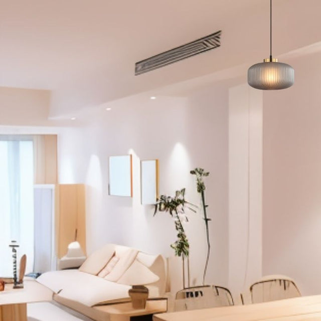 "Minimalistic pendant light made of iron and glass, adding modern elegance to a contemporary living room."