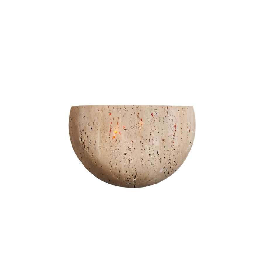 "A minimalist, semi-circular travertine wall lamp, isolated on a white background."