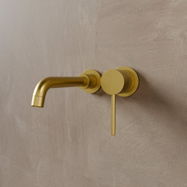 Vartay Bathroom Faucet in matte brushed gold finish, featuring a minimalist wall-mounted design with a single lever handle.
