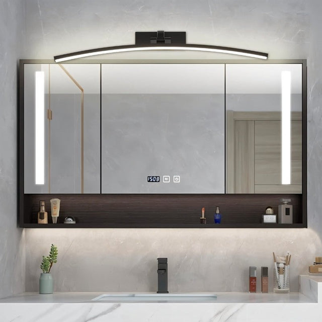 "A modern, curved LED wall lamp illuminating a bathroom mirror cabinet with a sink."
