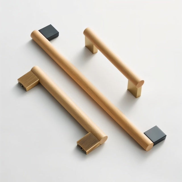 "Modern wood and brass handles with a minimalist design, suitable for contemporary cabinets and drawers."