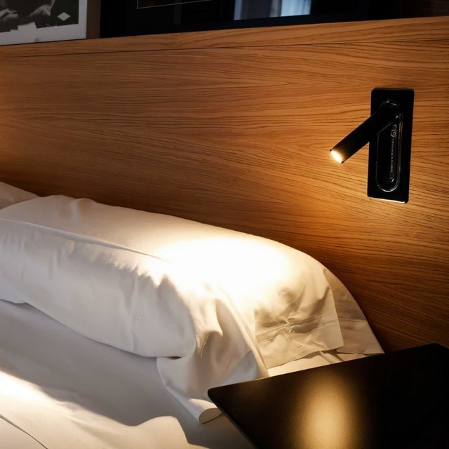 "Zarwa bedside reading lamp mounted on headboard, featuring a sleek, minimalist design with an adjustable spotlight for focused illumination, made of durable metal and acrylic."