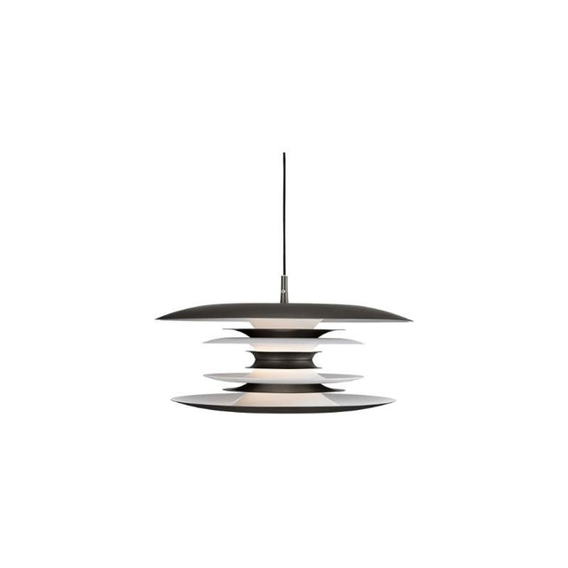 "A modern pendant light with layered discs in black and silver, suspended by a thin black cord against a white background."