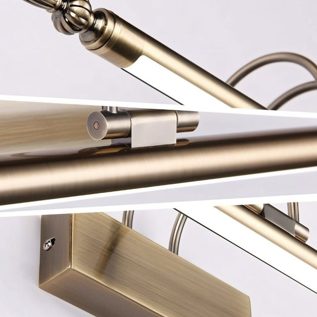 "Close-up collage of a silver wall lamp showing the decorative end caps, dual-arch supports, and mounting bracket details."