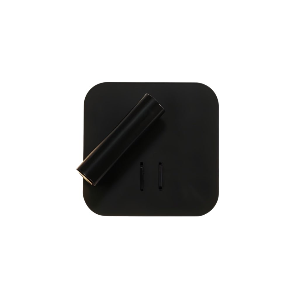 "A modern black square wall-mounted reading lamp with an adjustable cylindrical spotlight, showcasing its minimalist design, isolated on a white background."