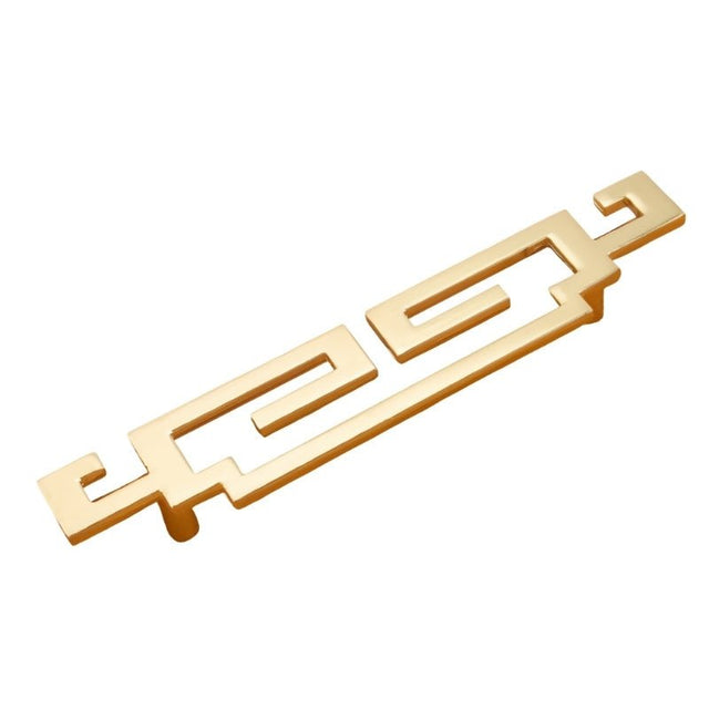 "A brushed gold, geometric pull bar with bold cutouts, made of zinc alloy, shown at an angle and isolated on a white background."