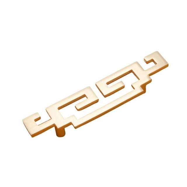 "A brushed gold, geometric pull bar with bold cutouts, made of zinc alloy, shown at an angle and isolated on a white background."