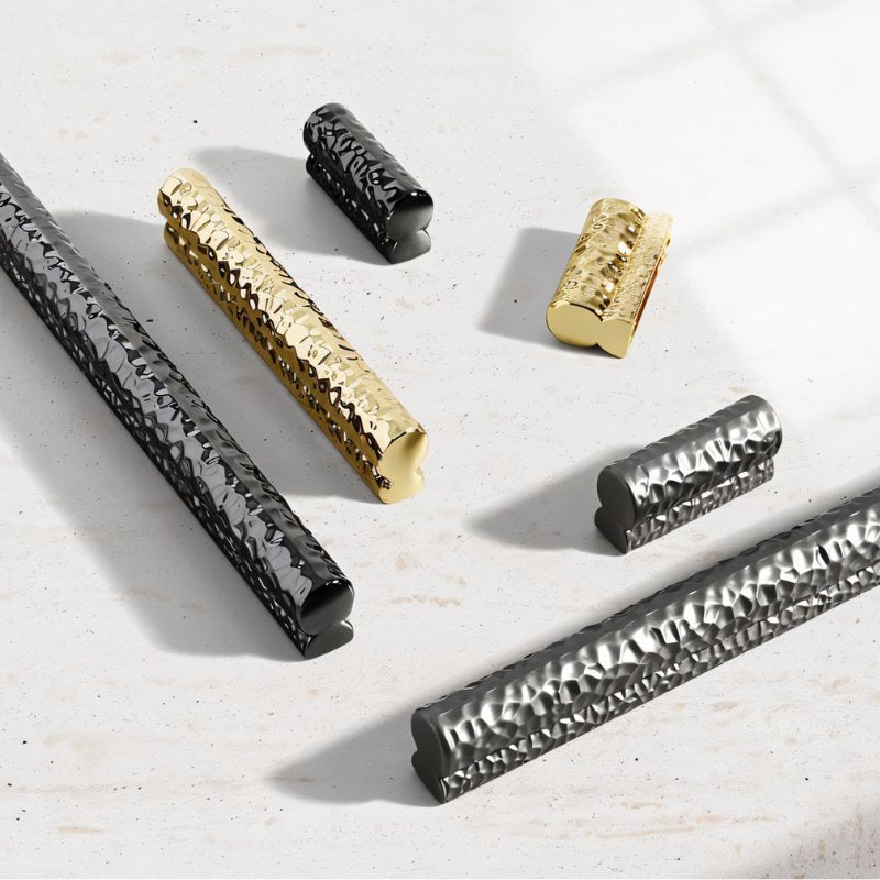 "Hammered texture pull bar handles in various metallic finishes, showcasing a blend of modern and handcrafted design."