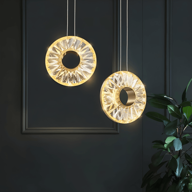 Zunel Pendant Light – Copper & Crystal Elegance in a dual halo design, suspended in a dark modern interior for ambient lighting.