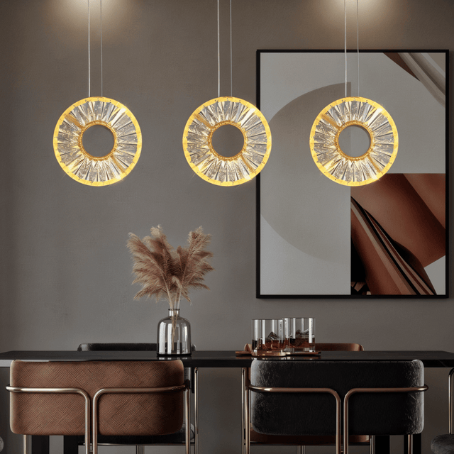 Zunel Pendant Light – Copper & Crystal Elegance trio above a dining table, enhancing contemporary decor with warm ambient lighting.