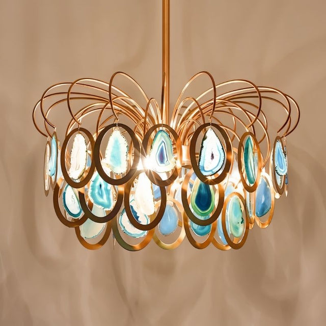 "A chandelier with an intricate iron frame and handcrafted agate stone accents."