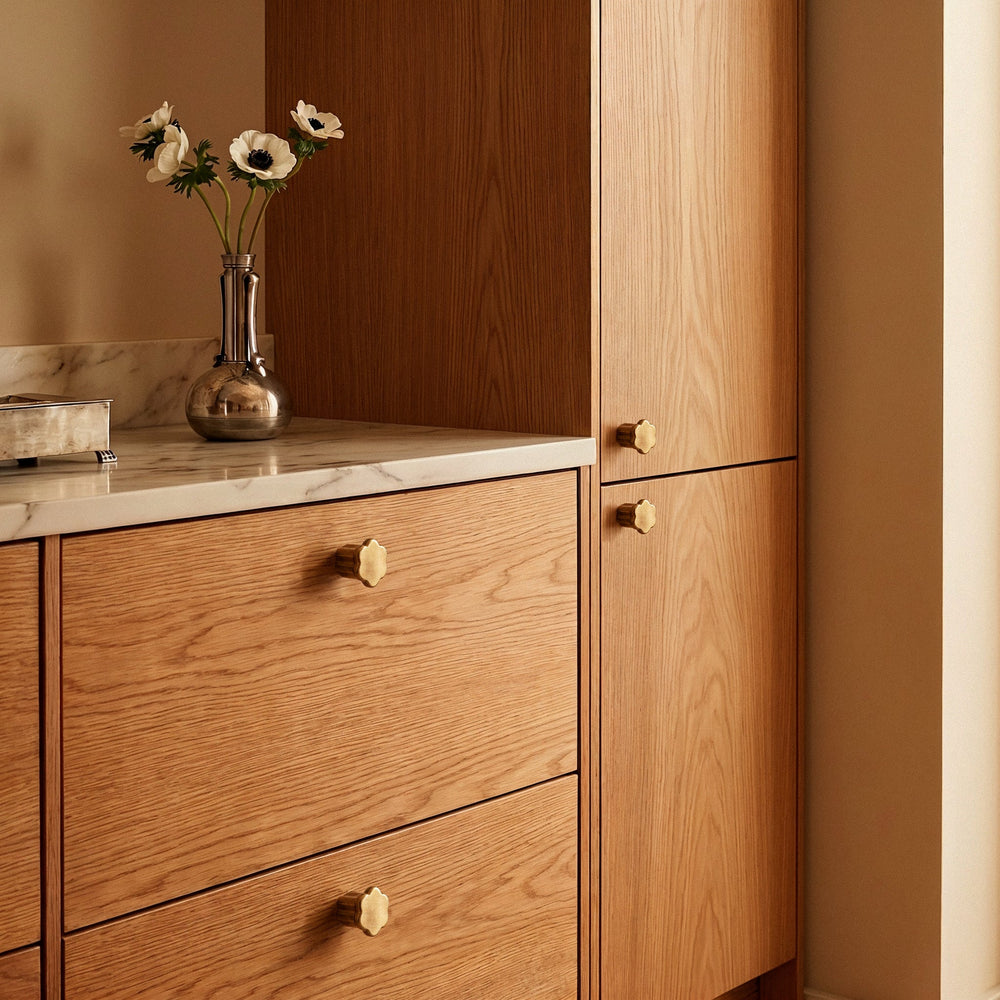 Gatsby Cabinet Knob in Satin Brass, installed in a vanity room