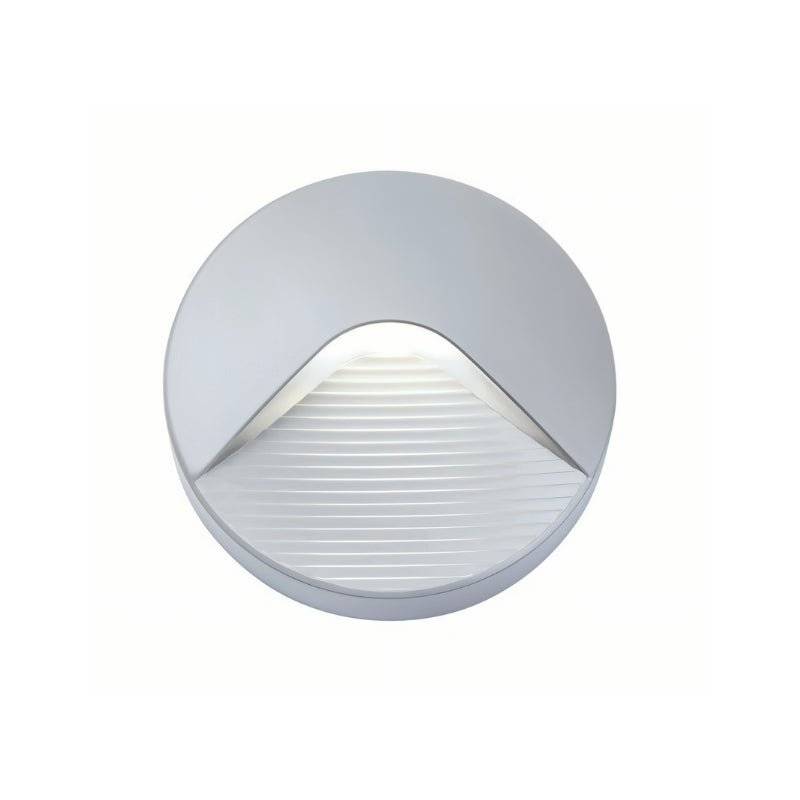 "A sleek, round step light with a minimalist design, featuring a durable plastic body and clear acrylic diffuser, providing a soft, focused downward glow for pathways.