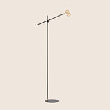 "Modern black steel floor lamp with an adjustable arm for focused lighting"