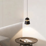 "Black pendant light with metal and glass, offering a modern glow, ideal for a contemporary side table setup."