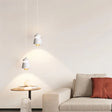 "Modern pendant light made of metal and glass, with a warm glow, perfect for contemporary living rooms."