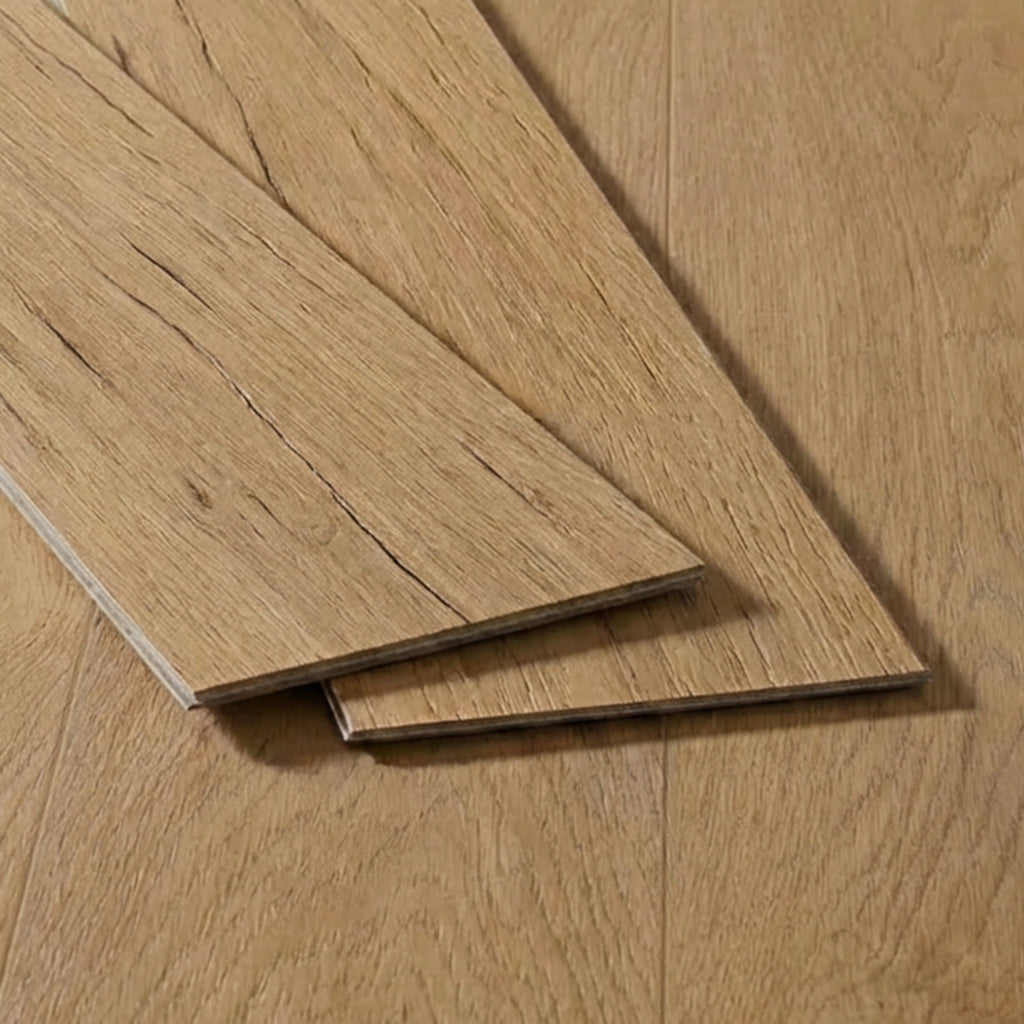 Two light oak wood flooring planks with natural grain texture displayed on a matching oak floor surface.