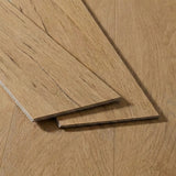 Two light oak wood flooring planks with natural grain texture displayed on a matching oak floor surface.