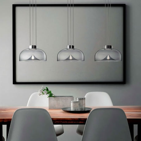 "Set of three modern glass pendant lights with adjustable suspension, perfect for contemporary spaces."
