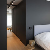 "Featuring a focused downward glow, this sleek aluminum light fixture is perfect for ambient and task lighting in modern homes."