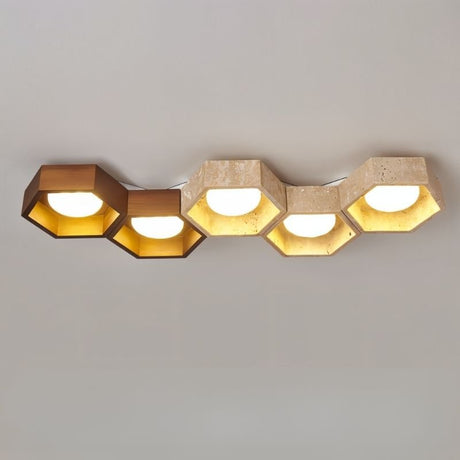 "Front-on view of honeycomb ceiling lamp with hexagonal design, travertine and walnut details"