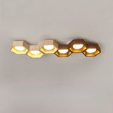 "Large honeycomb ceiling lamp configuration, travertine and walnut materials, diffused warm light"