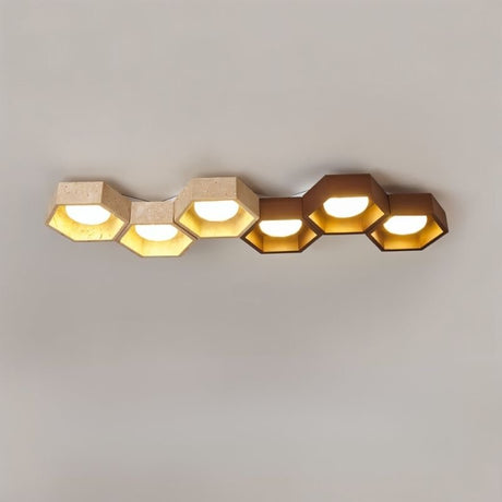 "Large honeycomb ceiling lamp configuration, travertine and walnut materials, diffused warm light"