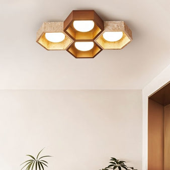 "Honeycomb ceiling lamp mounted in modern room, travertine and walnut materials, warm ambient light"