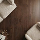 Dark oak wood plank flooring with natural grain texture, styled with cream upholstered furniture and coffee cup.