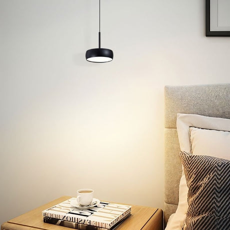 "Black aluminum pendant light illuminating bedroom, cozy ambiance, soft focused lighting"