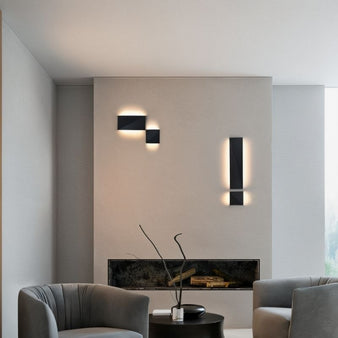 "wall-mounted lamp near fireplace, sleek aluminum fixture, matte black surface, ambient contemporary lighting"