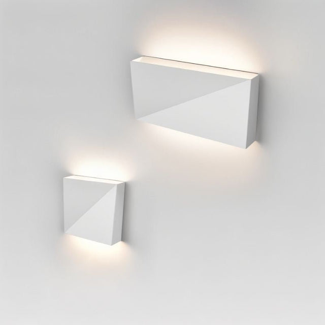 "closeup of white geometric wall lamp, sleek aluminum material, minimalist lighting fixture, ambient illumination"