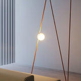 "triangular lamp structure with glowing glass orb, enhancing ambient lighting in modern interior"
