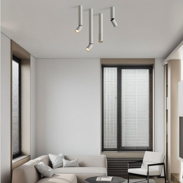 "Modern ceiling light fixture with adjustable heads, aluminum material, clean lines in a cozy lounge area"