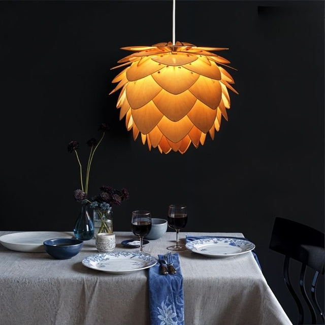"Wooden pendant lamp with warm light, layered petal design, nature-inspired ambiance over dining table"