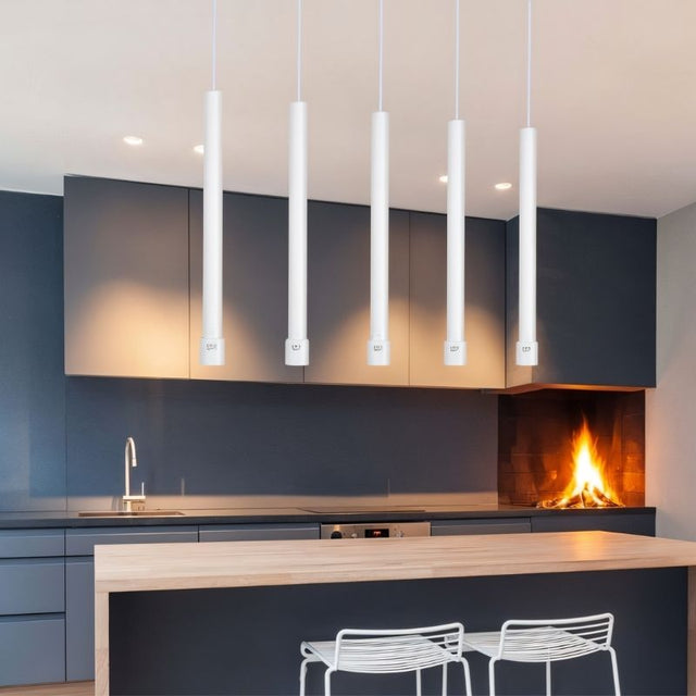 "White cylindrical pendant lights in modern kitchen, creating clean ambient and task lighting"