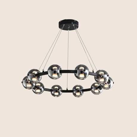 "Modern chandelier with aluminum frame and smoked glass orbs, suspended from the ceiling."