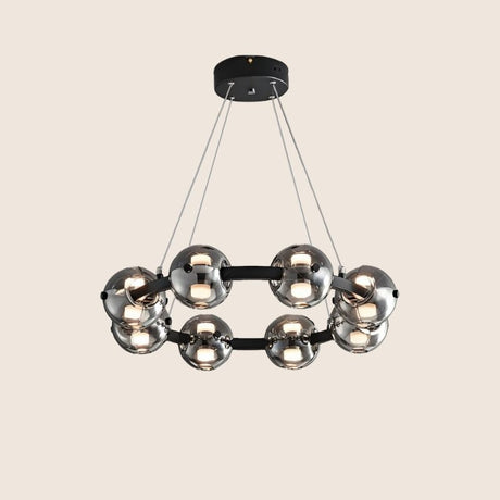 "Chandelier with smoked glass orbs and aluminum frame viewed from below."
