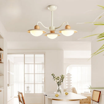 "Chandelier illuminating dining area, soft lampshades, natural wood accents, ambient lighting"