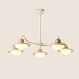 "Chandelier with five curved arms, wood and travertine materials, soft ambient lighting"