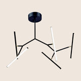 "Black modern chandelier with geometric arms, featuring integrated LED lights, adding a contemporary and industrial feel to the space."